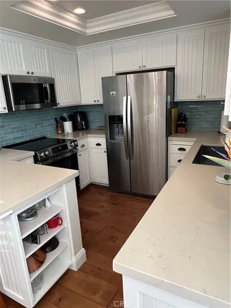 a kitchen with a refrigerator sink and microwave