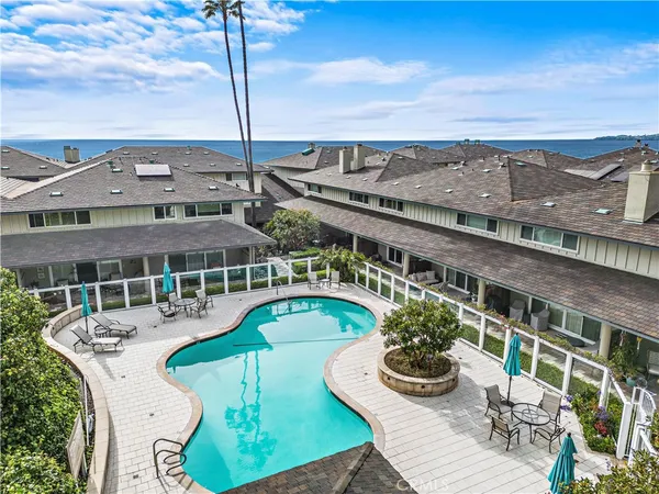 a view of a swimming pool with a patio