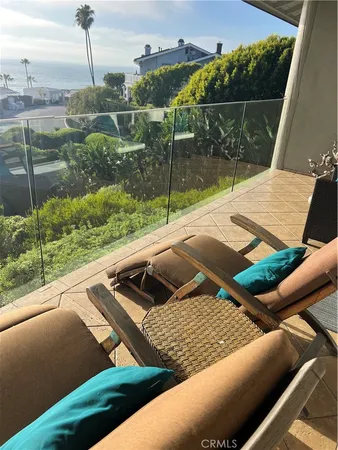 a view of a backyard with sitting area