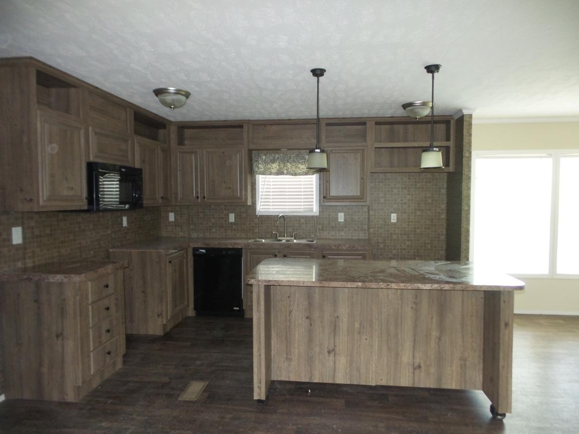 106 Webber Lane Clinton, TN 37716 - Photo 3 of 20 a kitchen with kitchen island granite countertop appliances cabinets and a counter top space