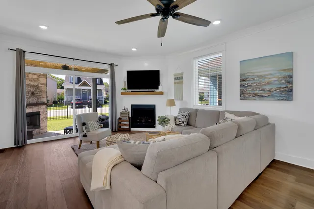 a spacious bedroom with a bed and a flat screen tv