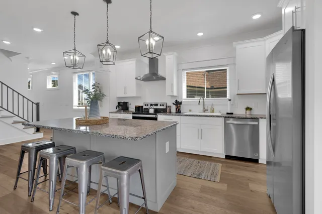 a living room with fireplace furniture and a garden