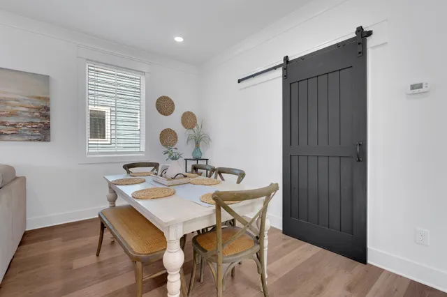a living room with fireplace furniture and a garden