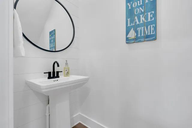 a view of a house with a yard and porch