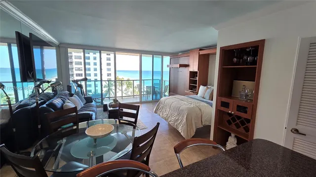 a bed room with furniture and a window