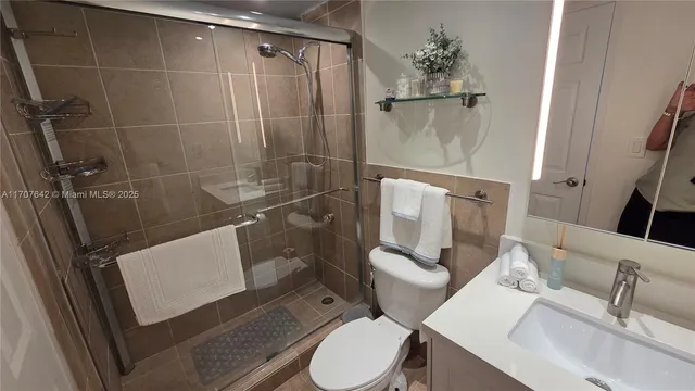 a view of a hallway with furniture and front door