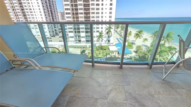 a view of a balcony with chairs