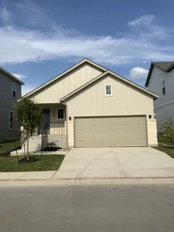 a front view of house along with street