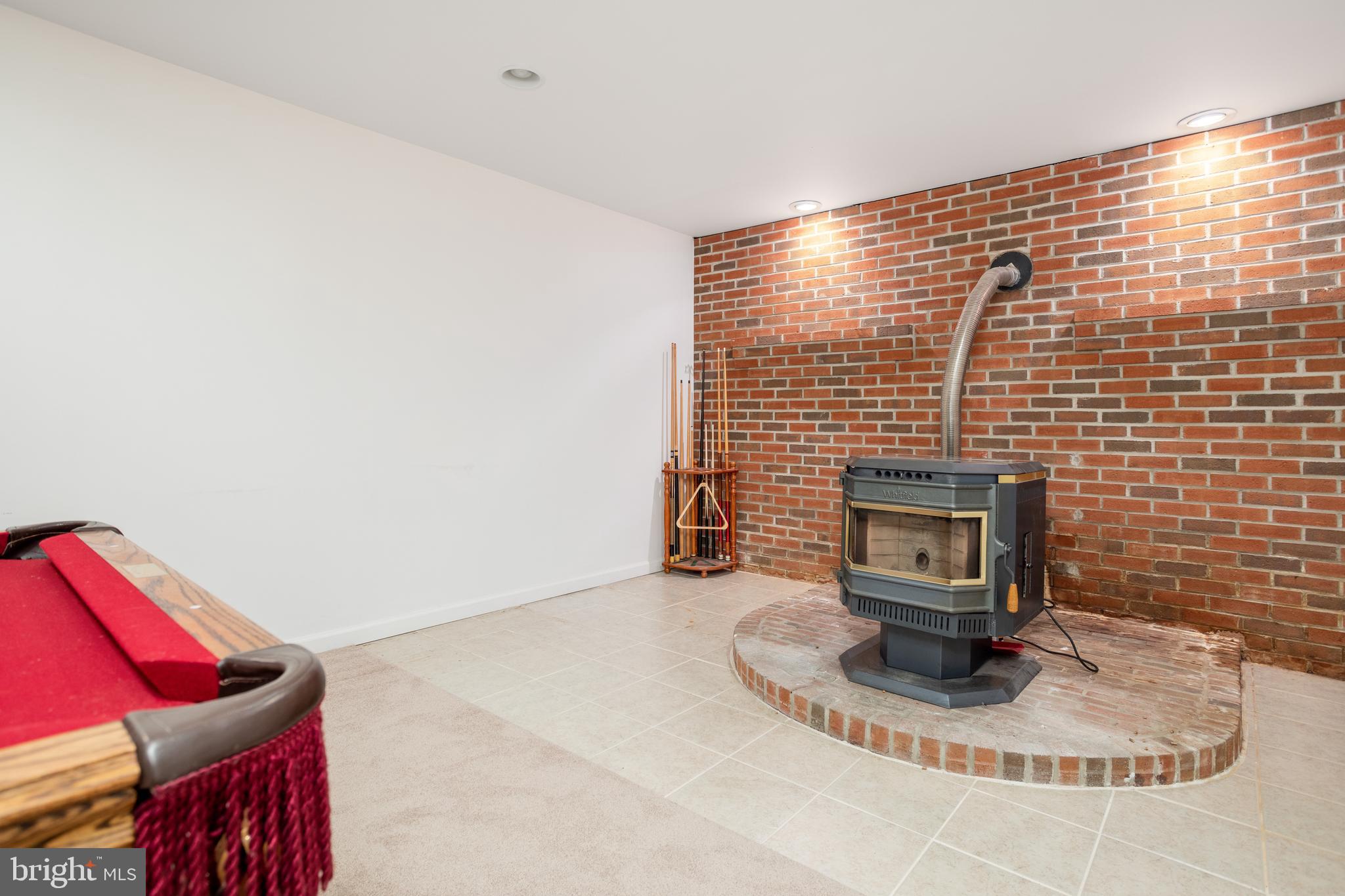 3365 Old Elk Neck Road Elkton, MD 21921 - Photo 15 of 21 Pellet stove in finished basement