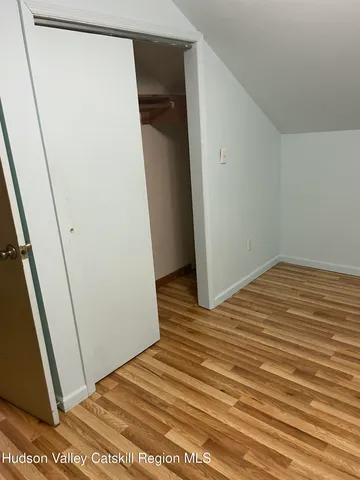 an aerial view of a house with a yard basket ball court and outdoor seating