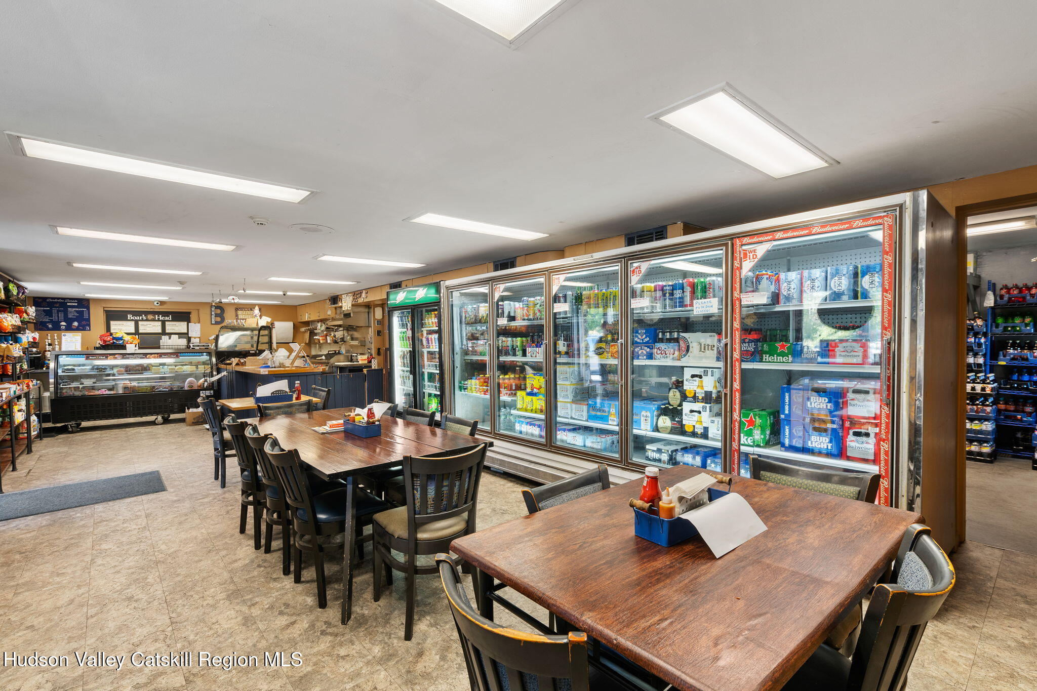 1218 Burlingham Road Pine Bush, NY 12566 - Photo 4 of 28 a view of a dining room with furniture and a potted plant