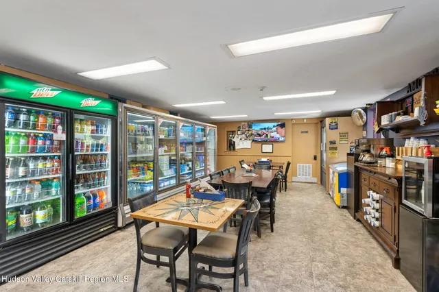 a bedroom with lots of furniture and a book shelf