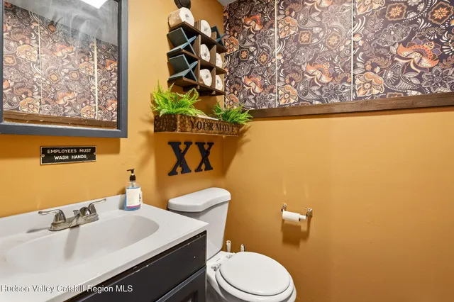 a kitchen with stainless steel appliances granite countertop a sink and a stove