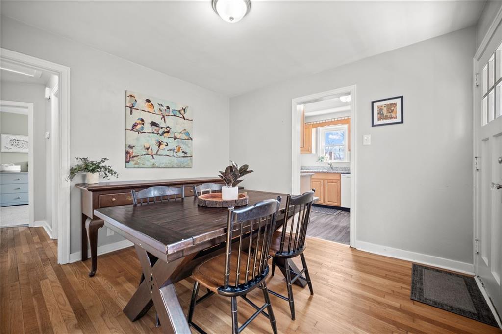 416 Phillips Avenue McKees Rocks, PA 15136 - Photo 13 of 46 a view of a dining room with furniture and wooden floor