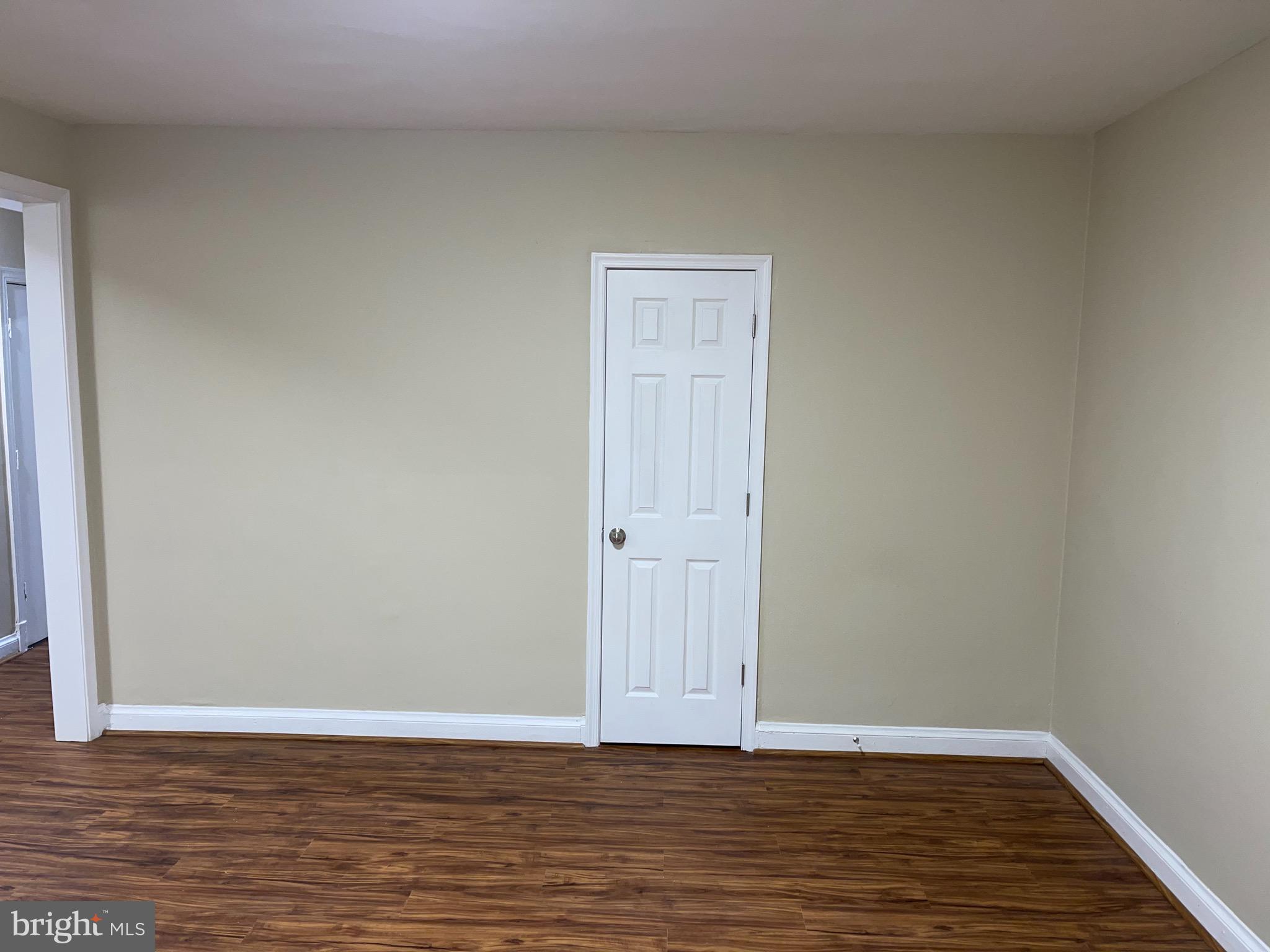 2210 Nicholson Street Southeast, Unit 3 Washington, DC 20020 - Photo 14 of 25 a view of an empty room with wooden floor