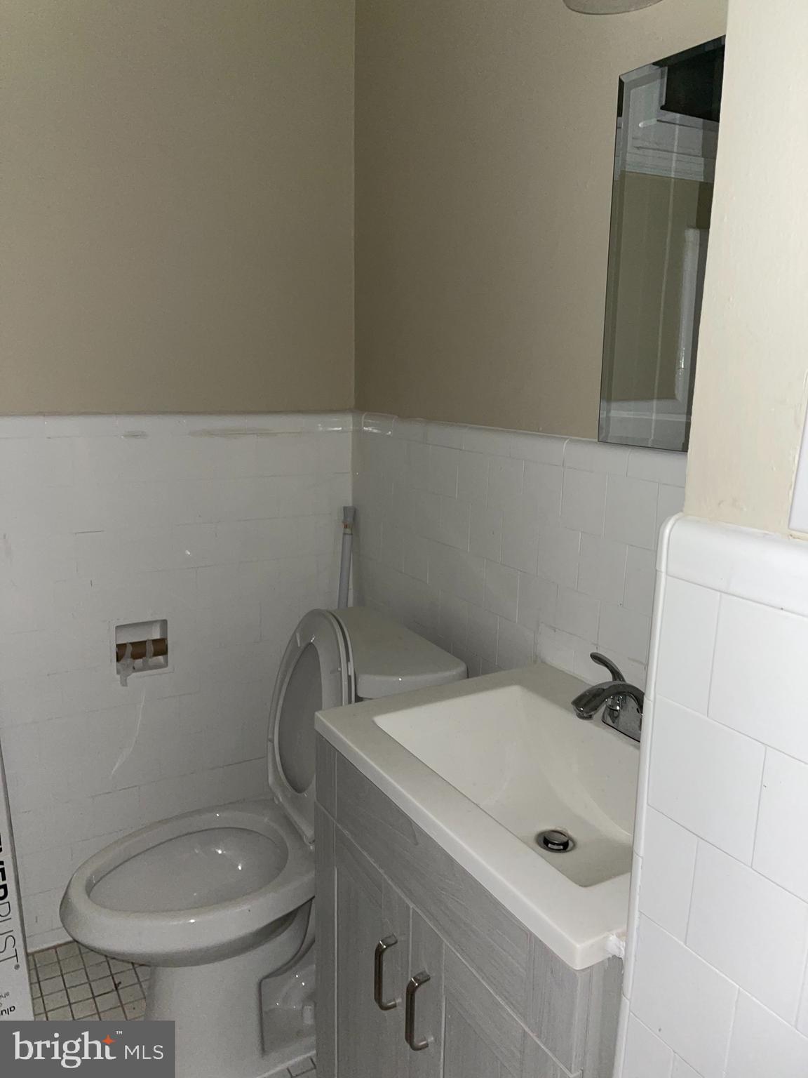 2210 Nicholson Street Southeast, Unit 3 Washington, DC 20020 - Photo 16 of 25 a bathroom with a toilet and a sink