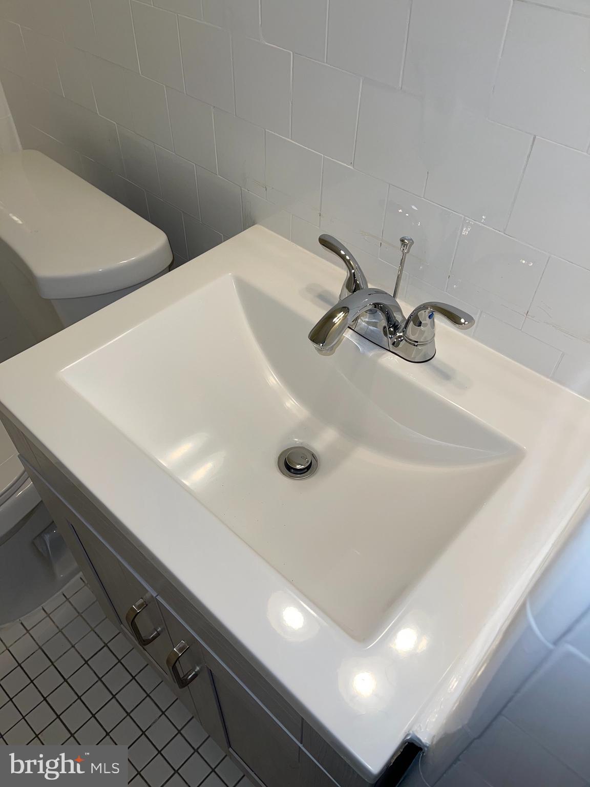 2210 Nicholson Street Southeast, Unit 3 Washington, DC 20020 - Photo 17 of 25 a bathroom with a sink