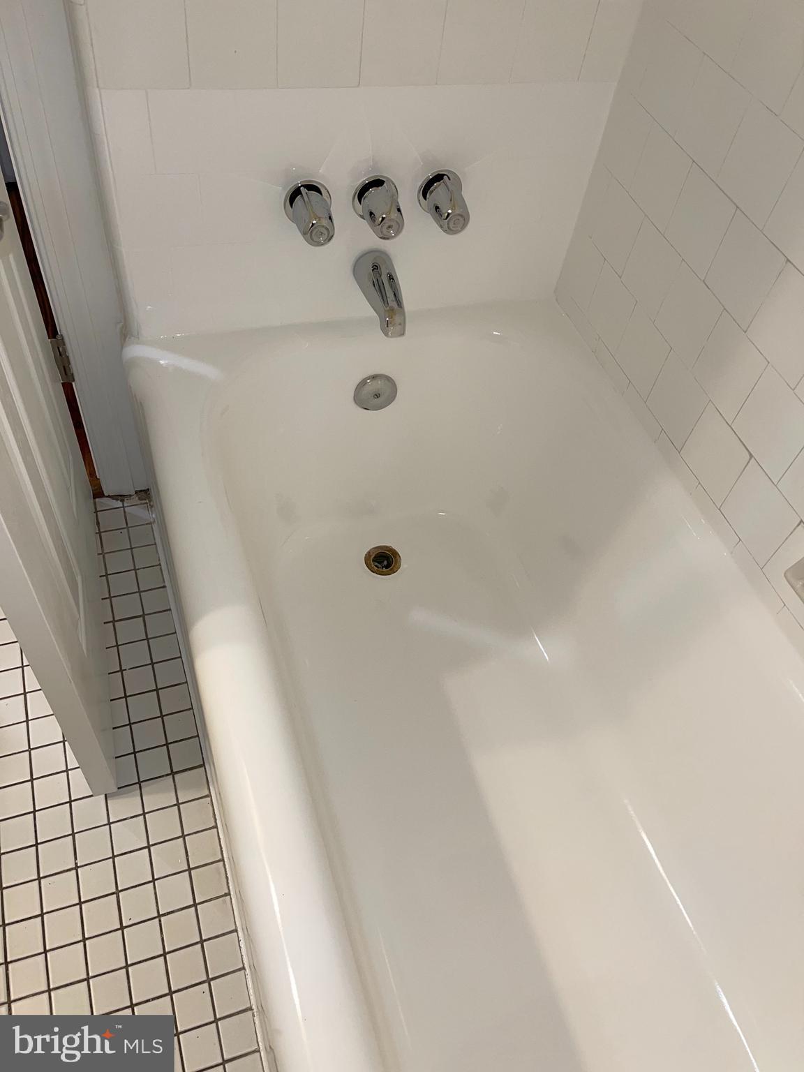 2210 Nicholson Street Southeast, Unit 3 Washington, DC 20020 - Photo 19 of 25 a bathroom with a shower