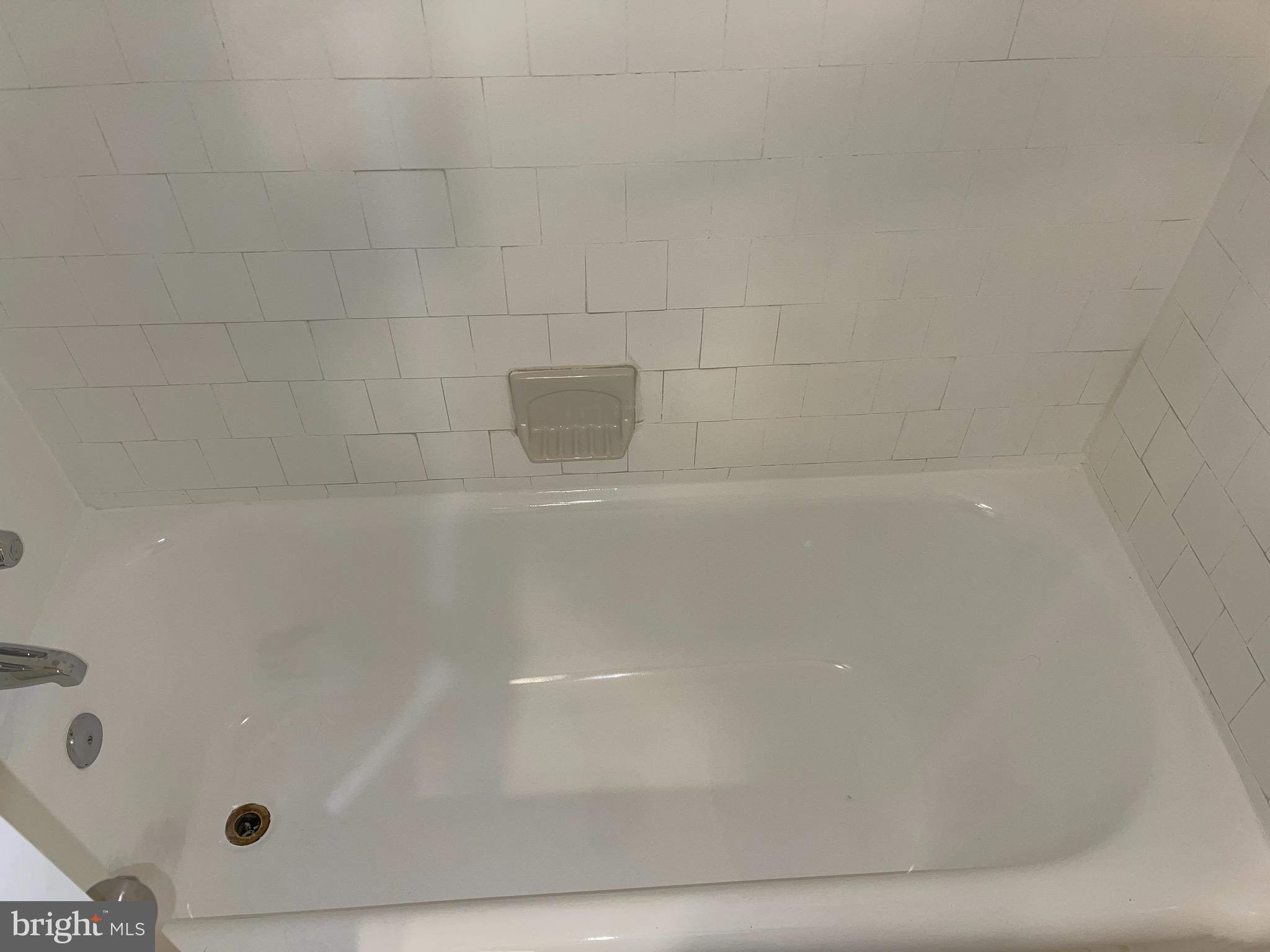 2210 Nicholson Street Southeast, Unit 3 Washington, DC 20020 - Photo 20 of 25 a close up of a bathtub