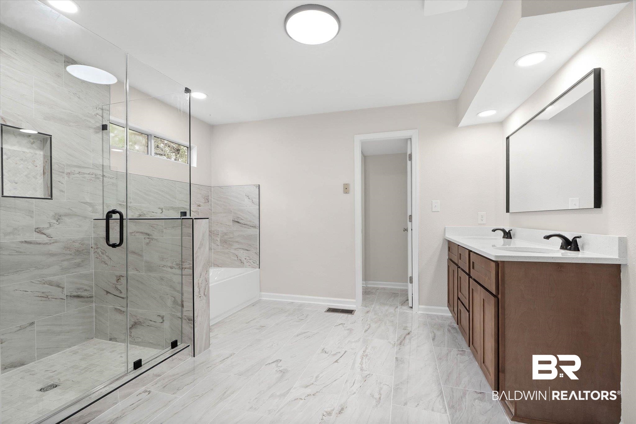 106 Melanie Loop Daphne, AL 36526 - Photo 16 of 45 Full bathroom with double vanity, a tub, a marble finish shower, recessed lighting, and light marble finish flooring
