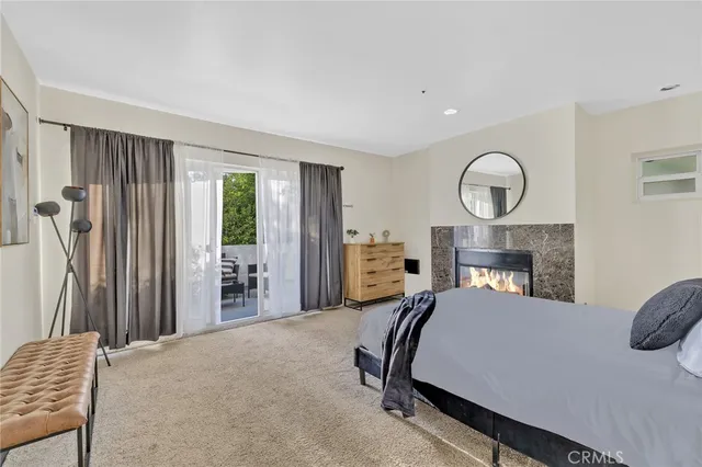 a bed room with a bed window and a chair