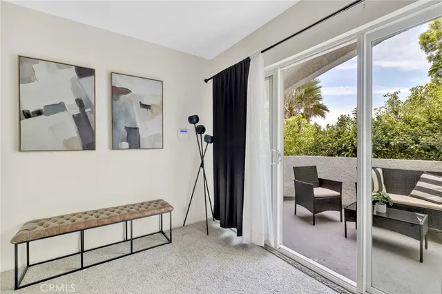 a bedroom with furniture and a window