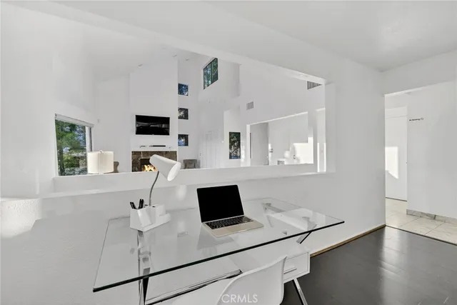 a white kitchen with a sink and a stove top oven