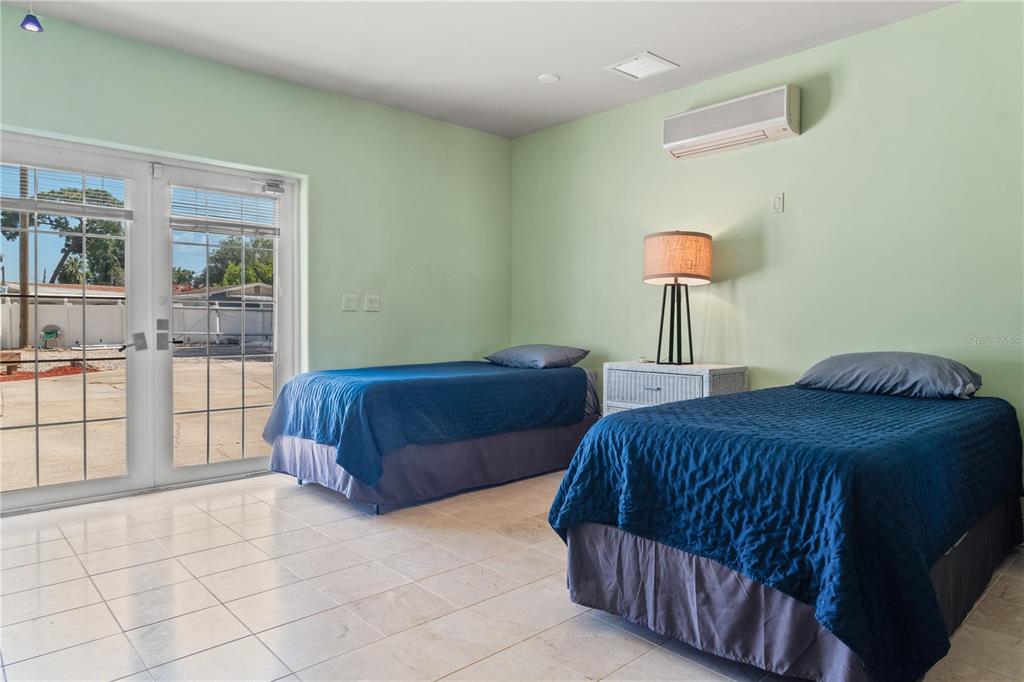 6515 Dimarco Road Tampa, FL 33634 - Photo 48 of 66 a bedroom with a bed and window