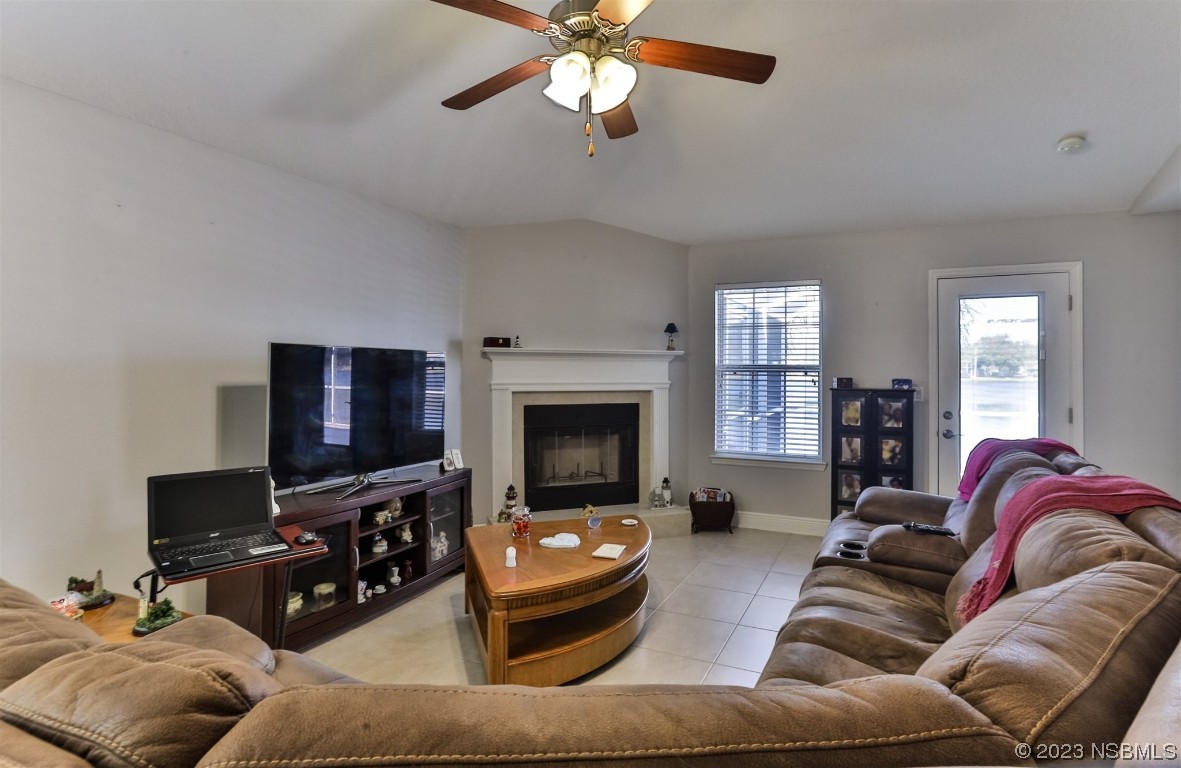 811 Star Reef Lane Edgewater, FL 32132 - Photo 18 of 35 a living room with furniture and a flat screen tv