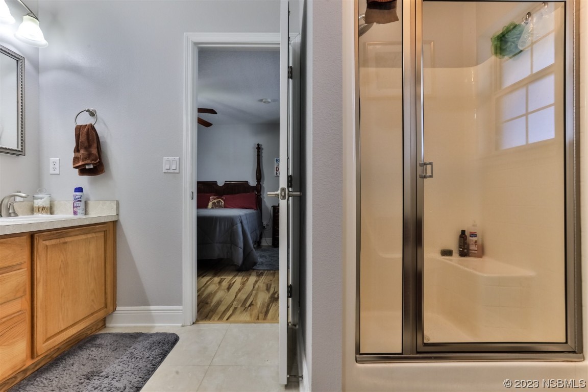 811 Star Reef Lane Edgewater, FL 32132 - Photo 24 of 35 a bathroom with a tub and a sink