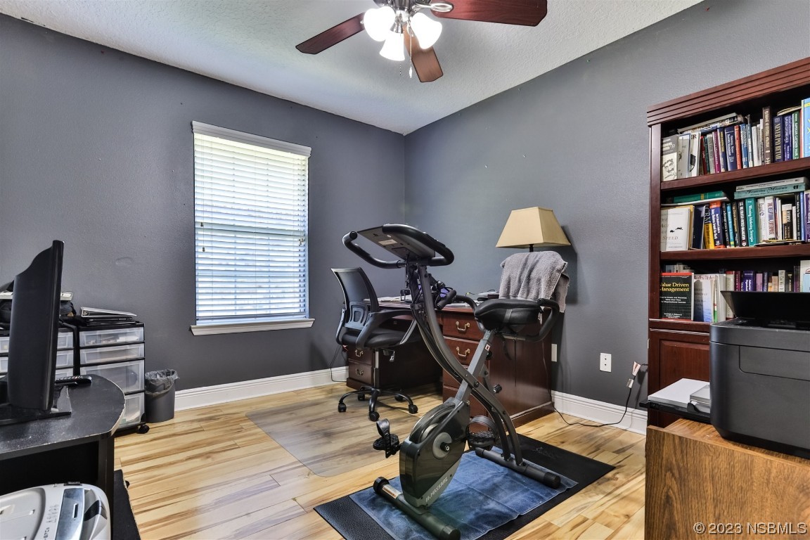 811 Star Reef Lane Edgewater, FL 32132 - Photo 25 of 35 a view of a workspace with furniture and a window