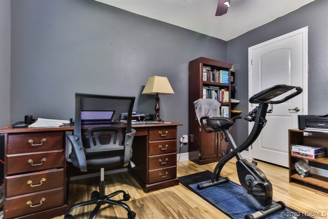 811 Star Reef Lane Edgewater, FL 32132 - Photo 26 of 35 a view of a workspace with furniture and a window