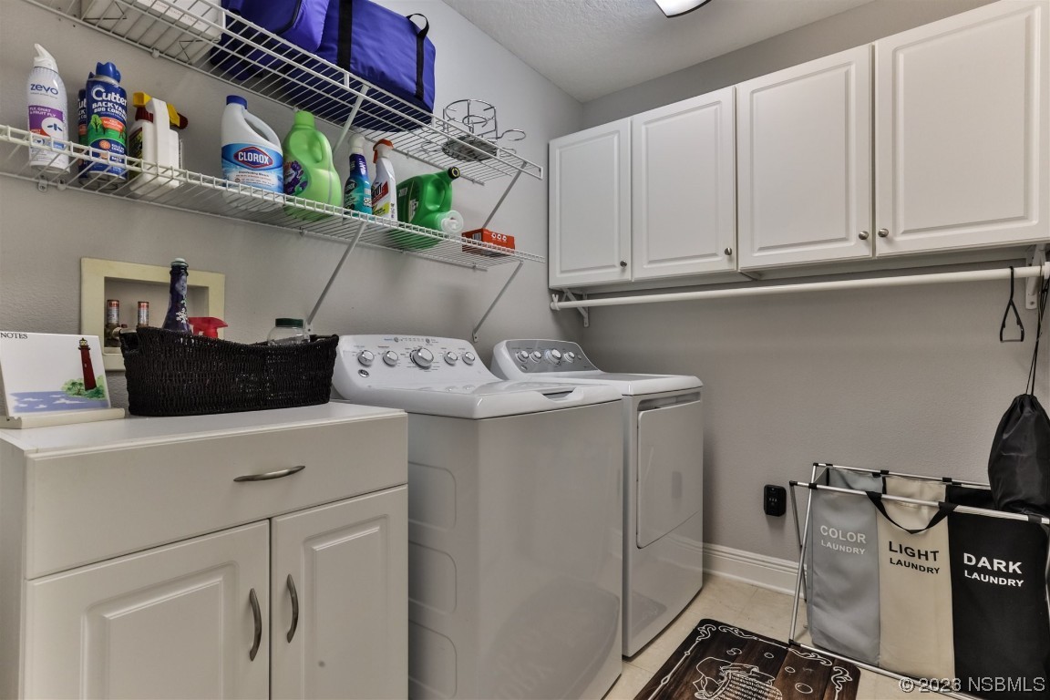 811 Star Reef Lane Edgewater, FL 32132 - Photo 30 of 35 a utility room with dryer and washer