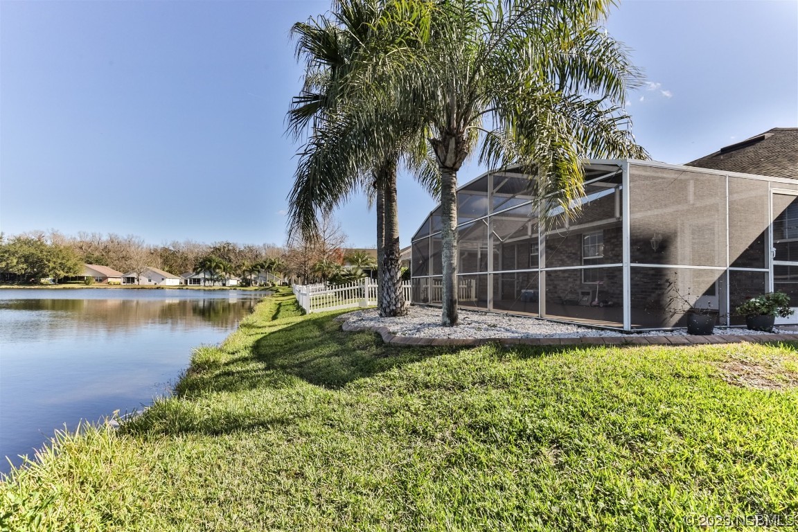 811 Star Reef Lane Edgewater, FL 32132 - Photo 3 of 35 a view of a garden with a building in the background