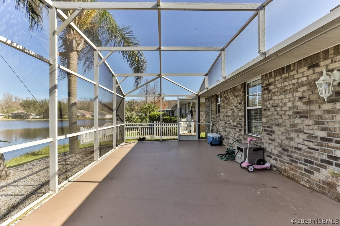 811 Star Reef Lane Edgewater, FL 32132 - Photo 33 of 35 a view of a garage with wooden table and chairs