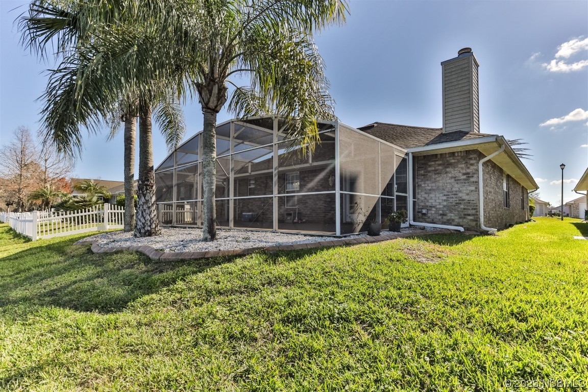 811 Star Reef Lane Edgewater, FL 32132 - Photo 34 of 35 a front view of a house with a yard