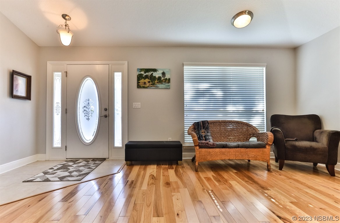 811 Star Reef Lane Edgewater, FL 32132 - Photo 5 of 35 a living room with furniture and a wooden floor
