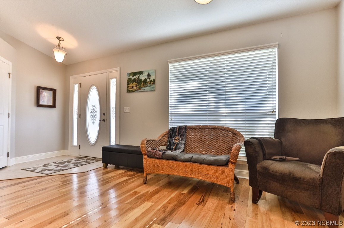 811 Star Reef Lane Edgewater, FL 32132 - Photo 6 of 35 a living room with furniture window and wooden floor