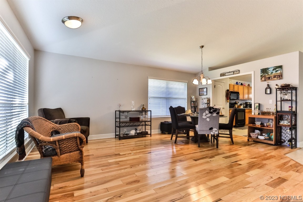 811 Star Reef Lane Edgewater, FL 32132 - Photo 7 of 35 a living room with furniture and a flat screen tv