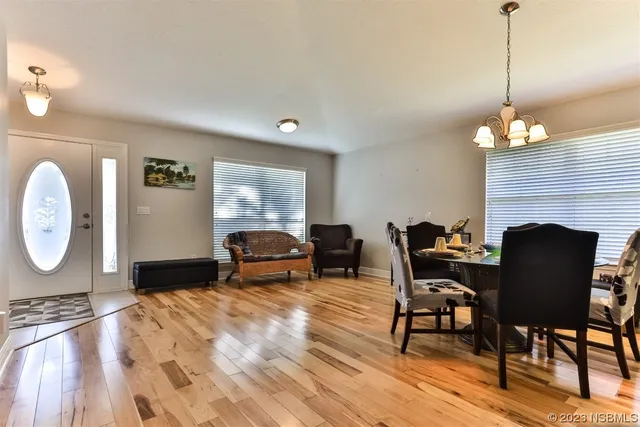 a living room with furniture a table and a fireplace