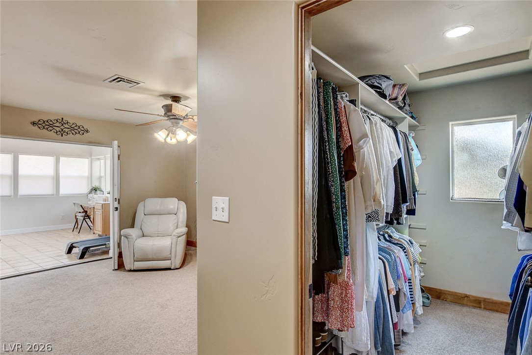 1950 Bowman Road Logandale, NV 89021 - Photo 32 of 81 A well-appointed walk-in closet offers ample storage adjacent to a versatile room with plentiful natural light.