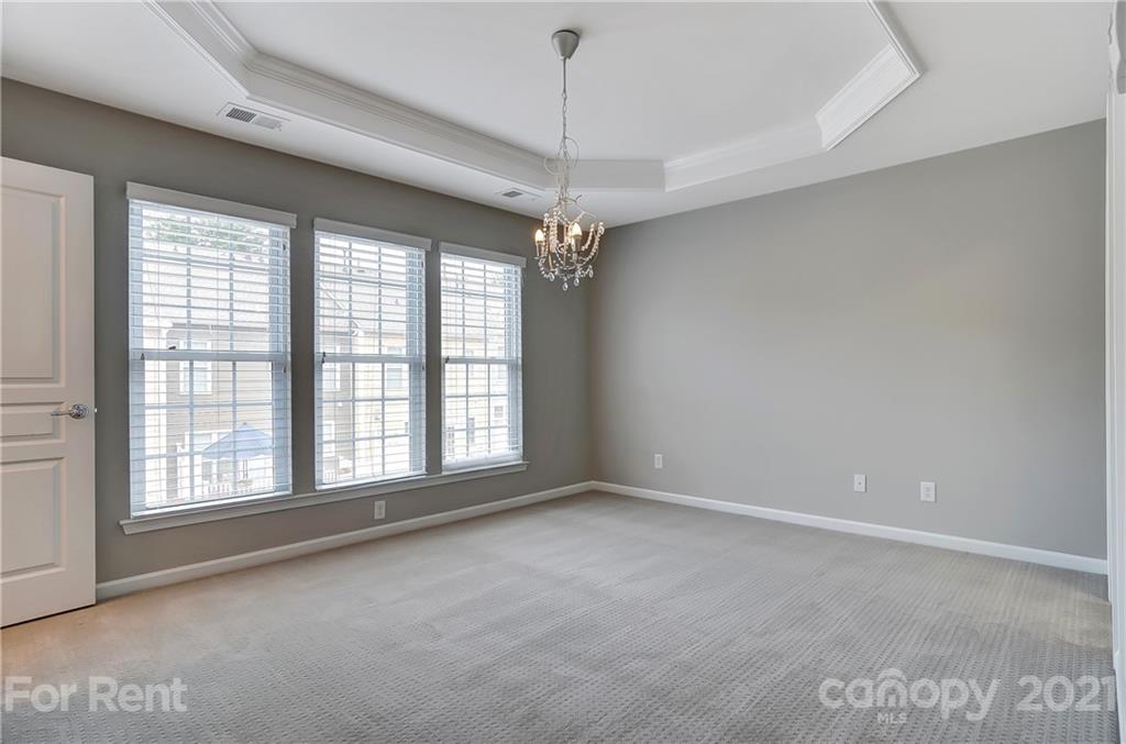 905 Lyndley Drive Fort Mill, SC 29708 - Photo 17 of 28 a view of a room with windows and chandelier