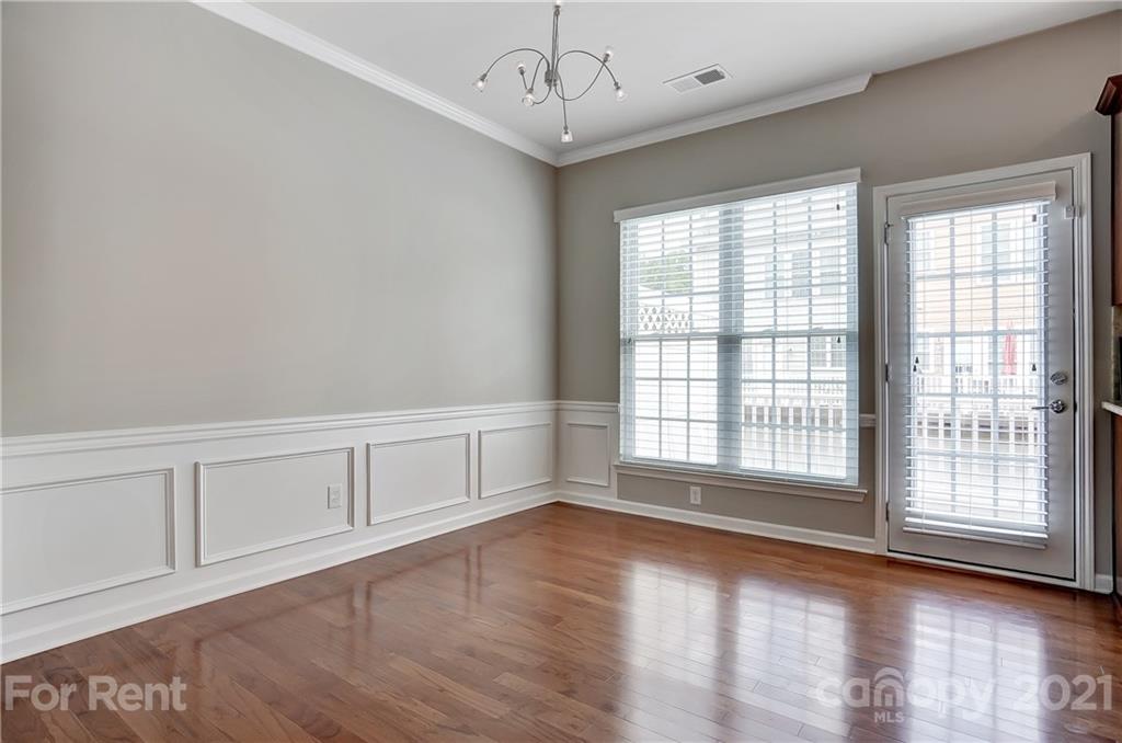 905 Lyndley Drive Fort Mill, SC 29708 - Photo 8 of 28 a view of an empty room with wooden floor and a window