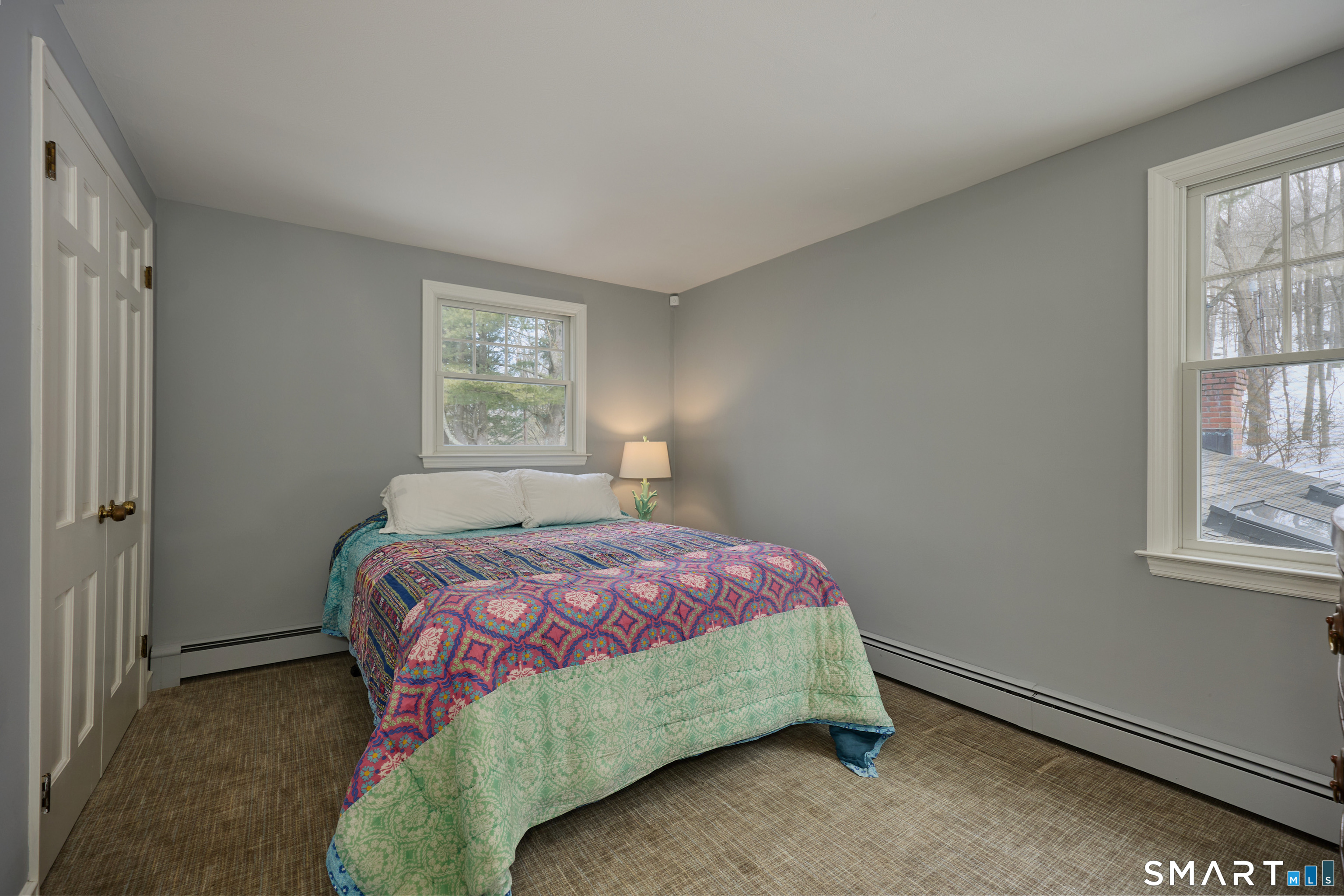 41 Old Mill Road Ridgefield, CT 06877 - Photo 22 of 33 a bedroom with a bed and a window