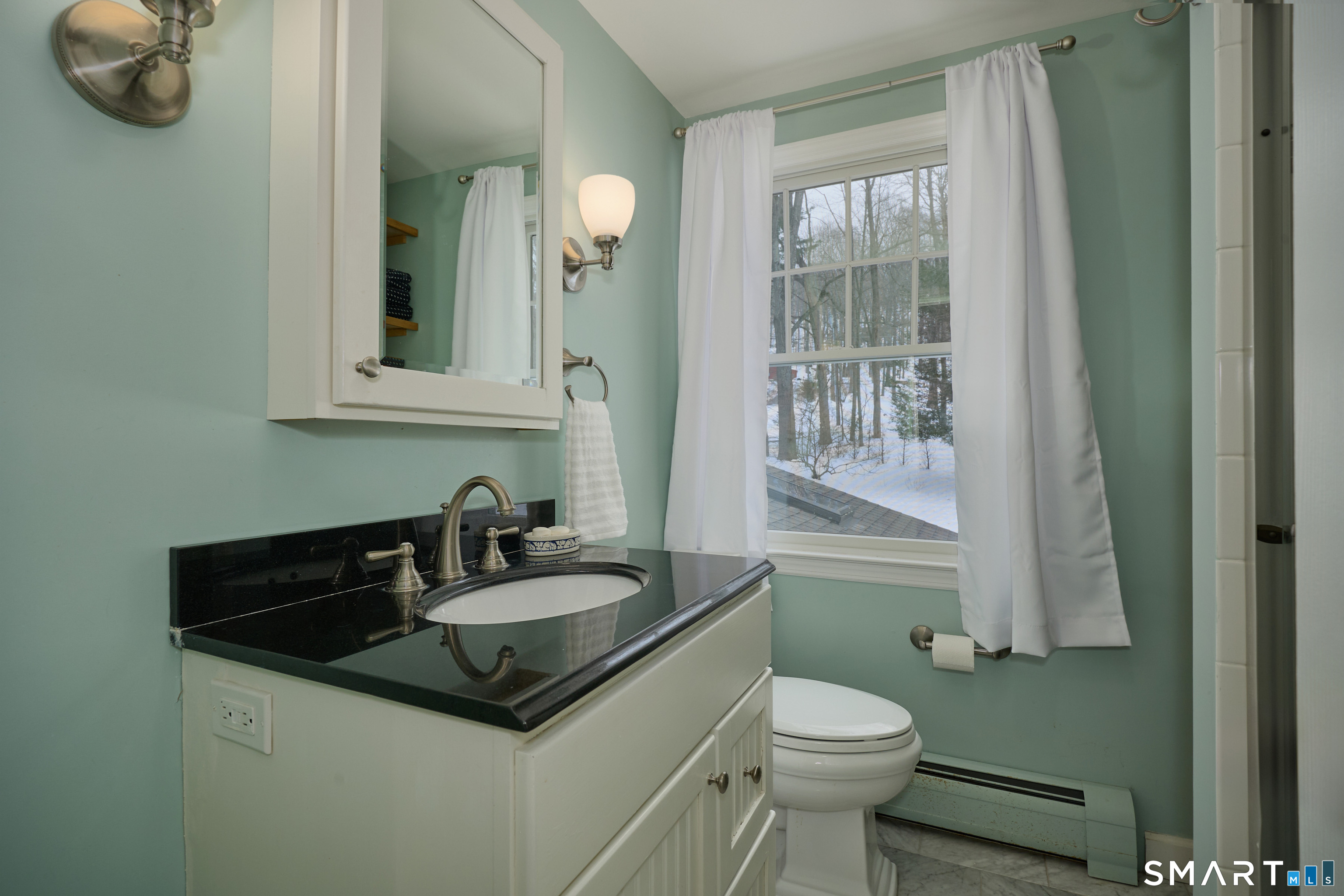 41 Old Mill Road Ridgefield, CT 06877 - Photo 23 of 33 a bathroom with a sink a toilet and mirror
