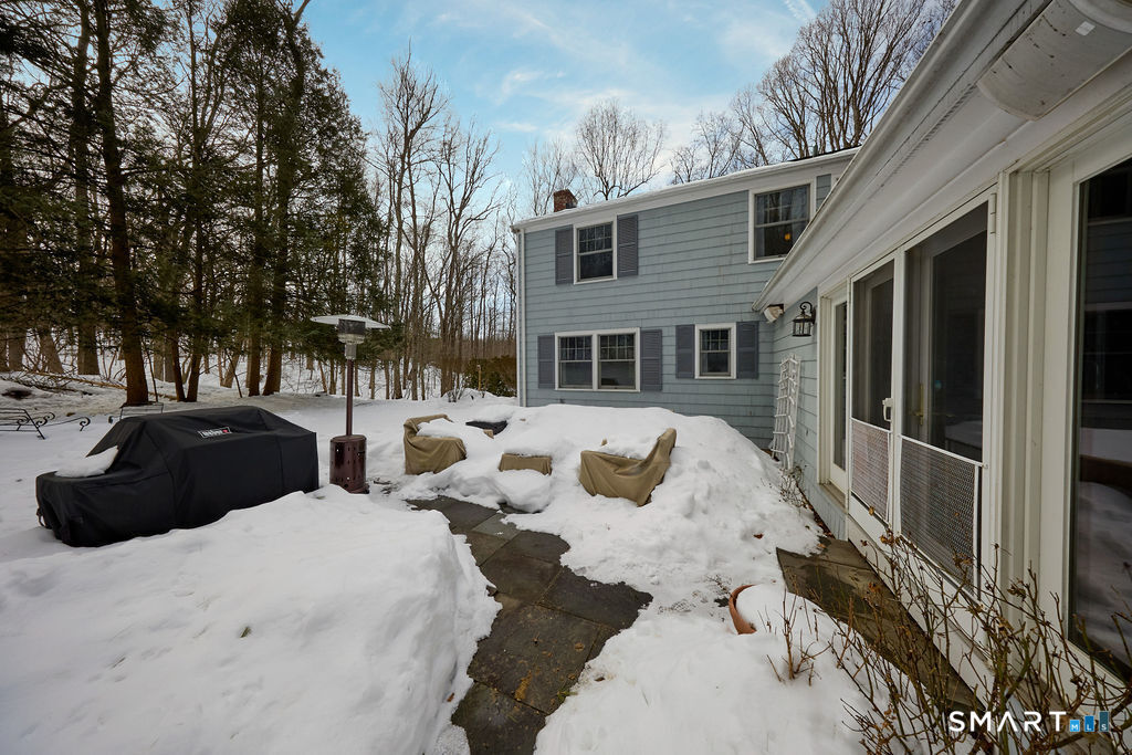 41 Old Mill Road Ridgefield, CT 06877 - Photo 33 of 33 a view of a house with a yard covered in snow