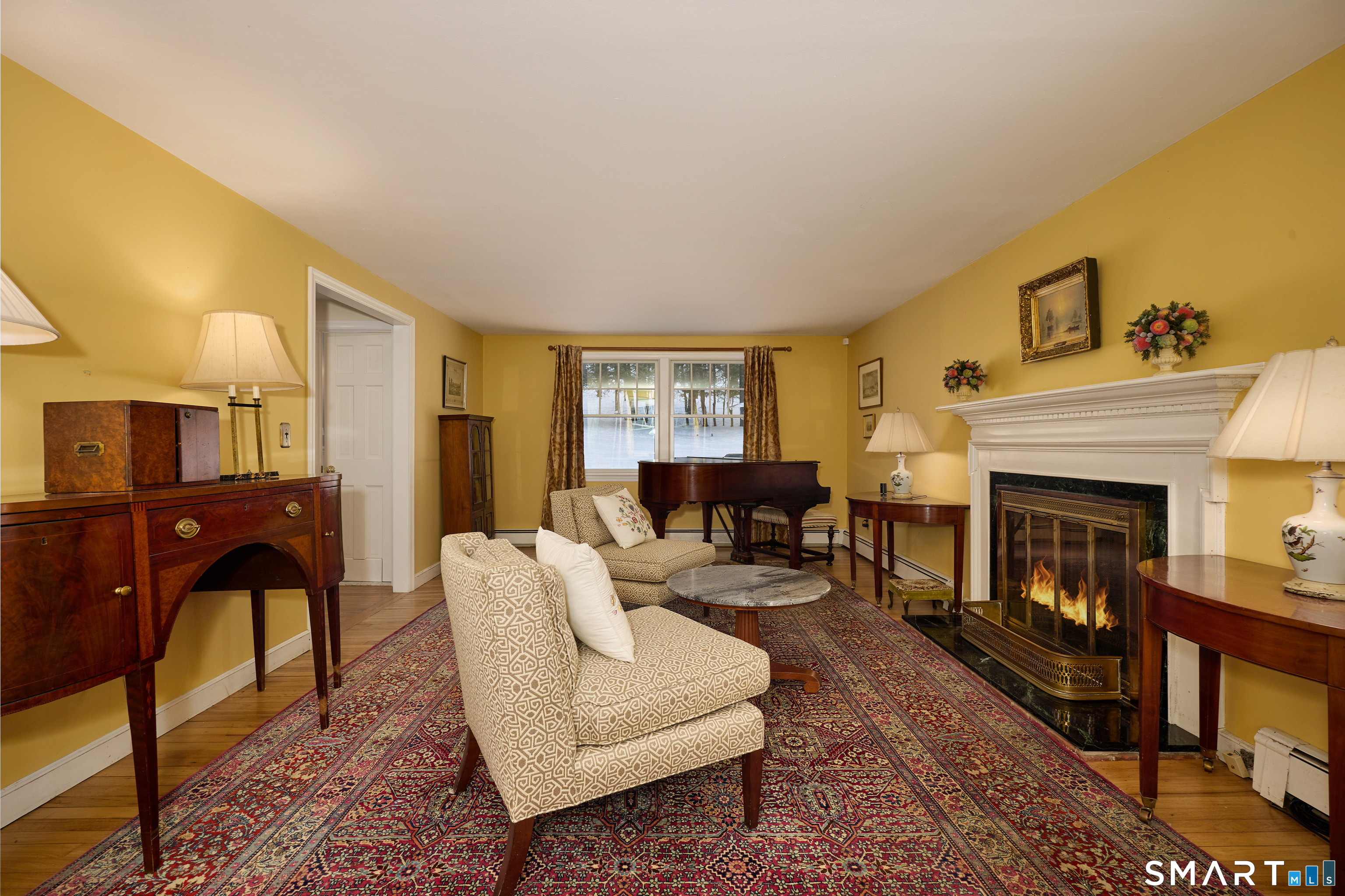 41 Old Mill Road Ridgefield, CT 06877 - Photo 5 of 33 a living room with furniture and a fireplace