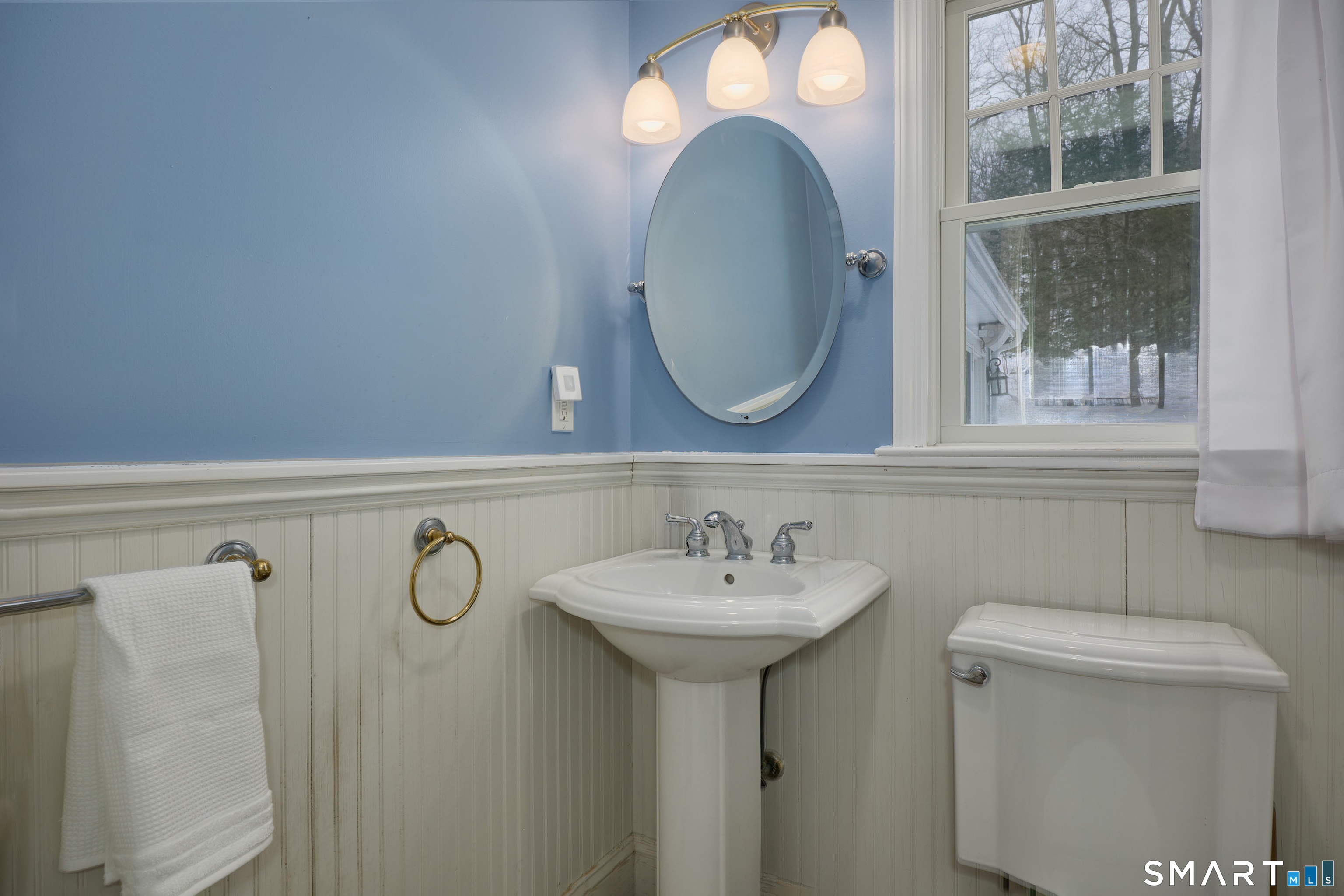 41 Old Mill Road Ridgefield, CT 06877 - Photo 7 of 33 a bathroom with a sink and a mirror