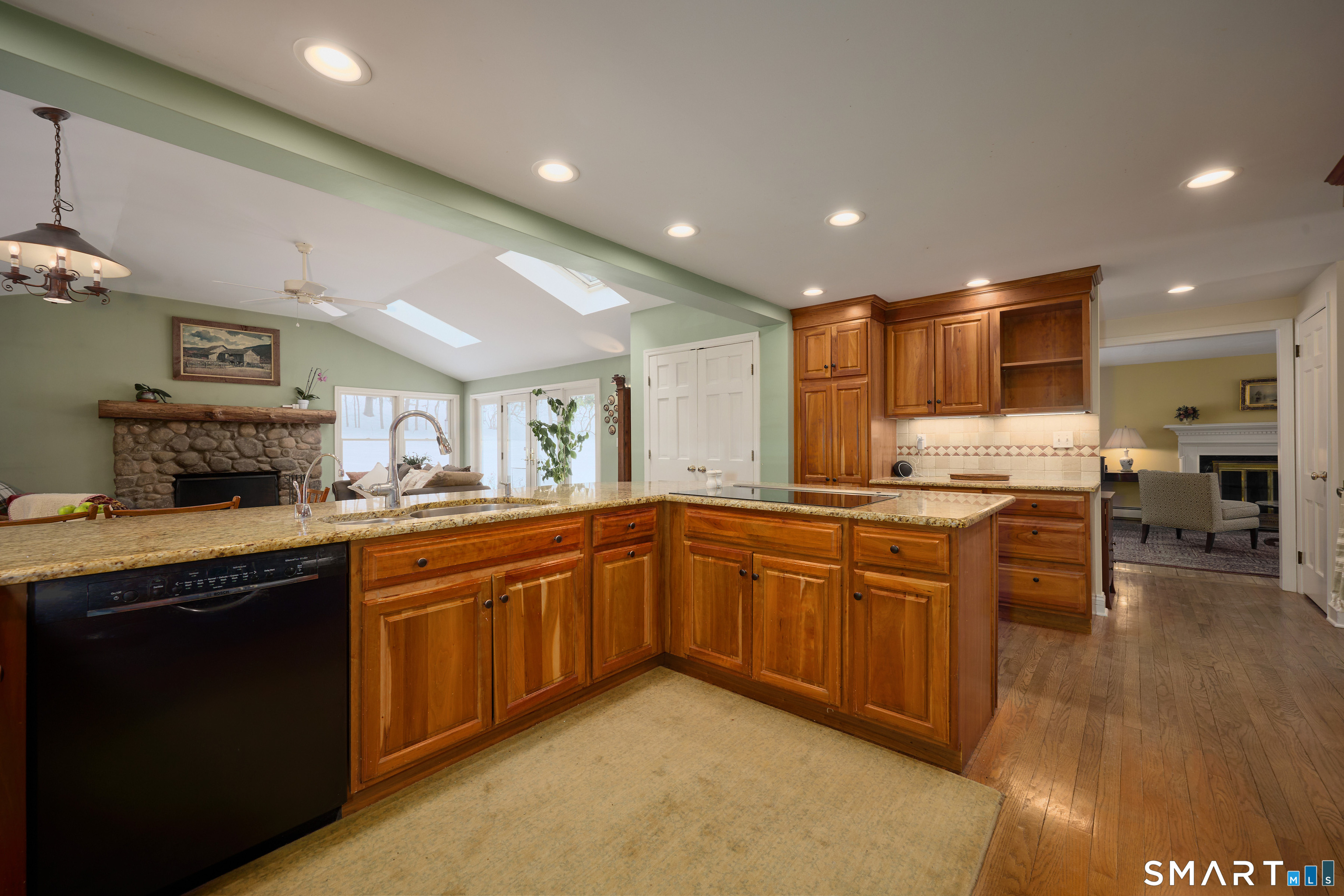 41 Old Mill Road Ridgefield, CT 06877 - Photo 10 of 33 a kitchen with stainless steel appliances granite countertop wooden cabinets a sink dishwasher a stove and a refrigerator