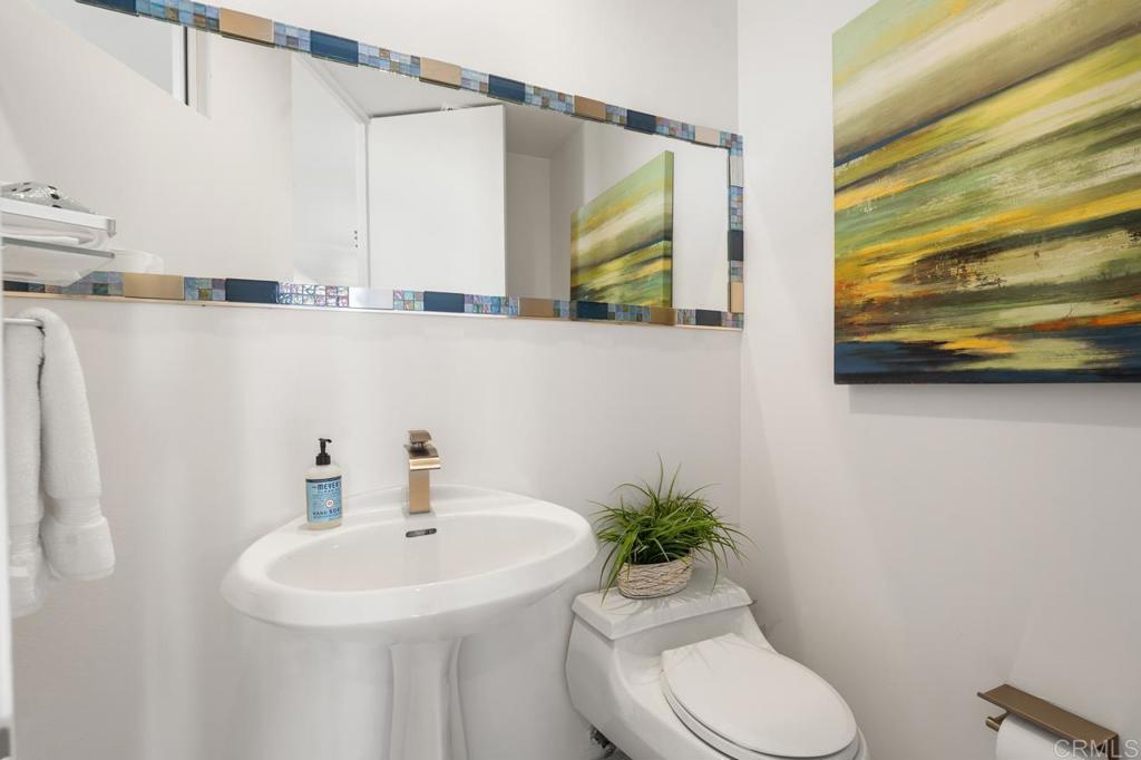 170 Solana Point Circle Solana Beach, CA 92075 - Photo 26 of 68 a bathroom with a sink a toilet and a mirror